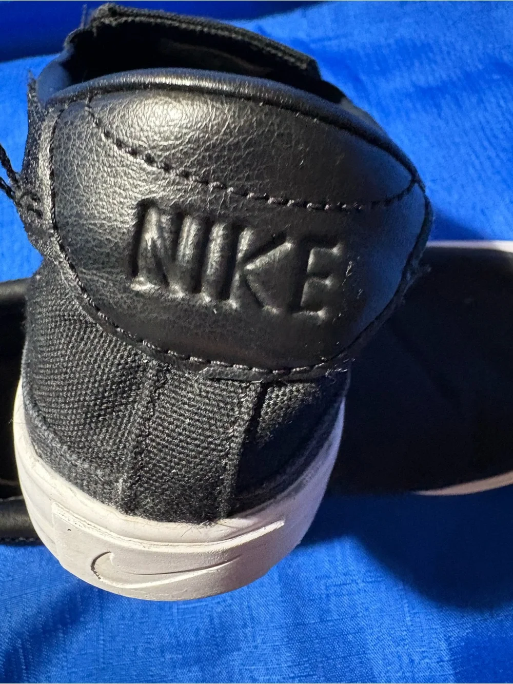 Nike Black Slip-On Canvas Sneakers with White Swoosh